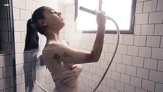 Captivating beauty Apolonia is masturbating pussy in the shower
